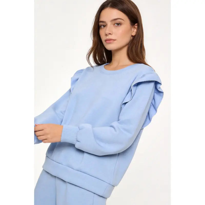 Women's tracksuit with ruffled top and trousers