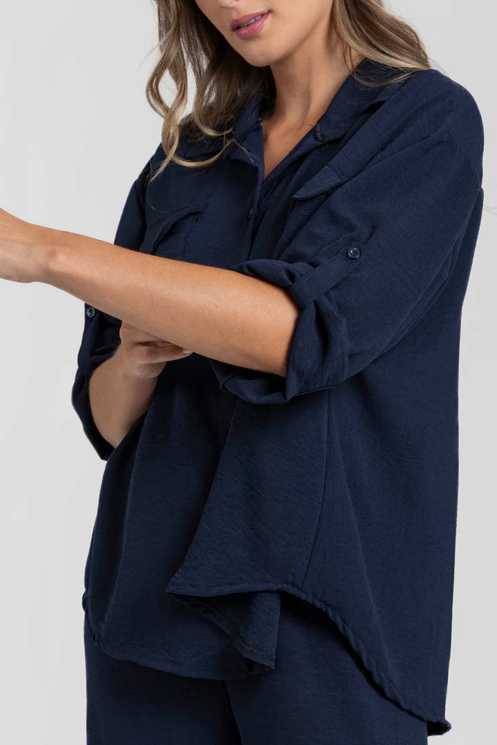 Two-piece set: loose-fitting shirt-style top, loose-fitting trousers, elastic waistband.