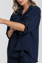 Two-piece set: loose-fitting shirt-style top, loose-fitting trousers, elastic waistband.