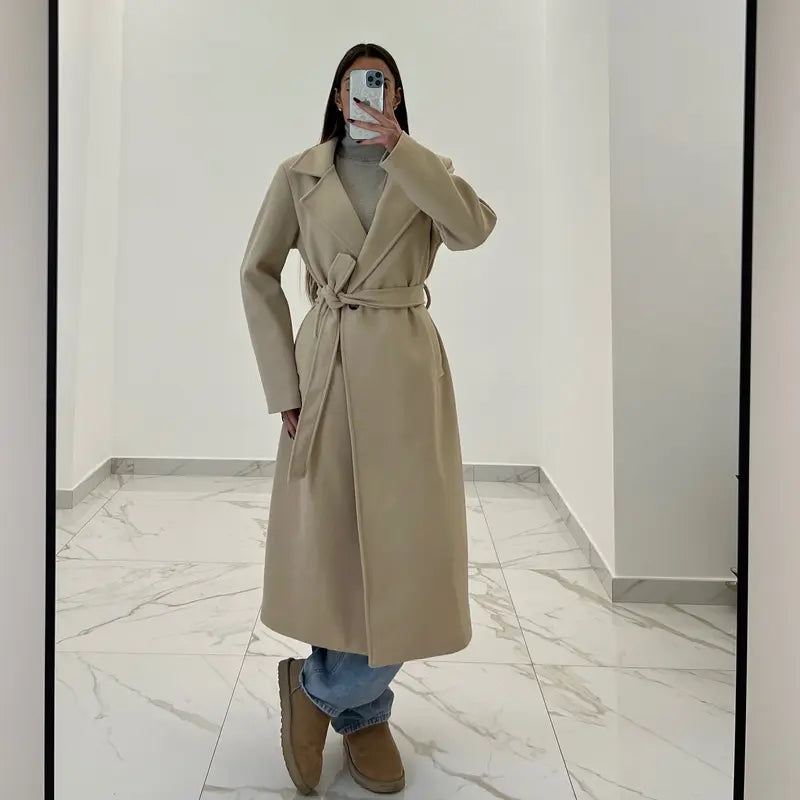 Coat with a belt at the waist