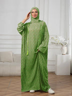 Plus-Size Fashion Floral Dress with Hood and Drawstring — featuring a loose fit, long lantern sleeves, and a modest yet casual style.