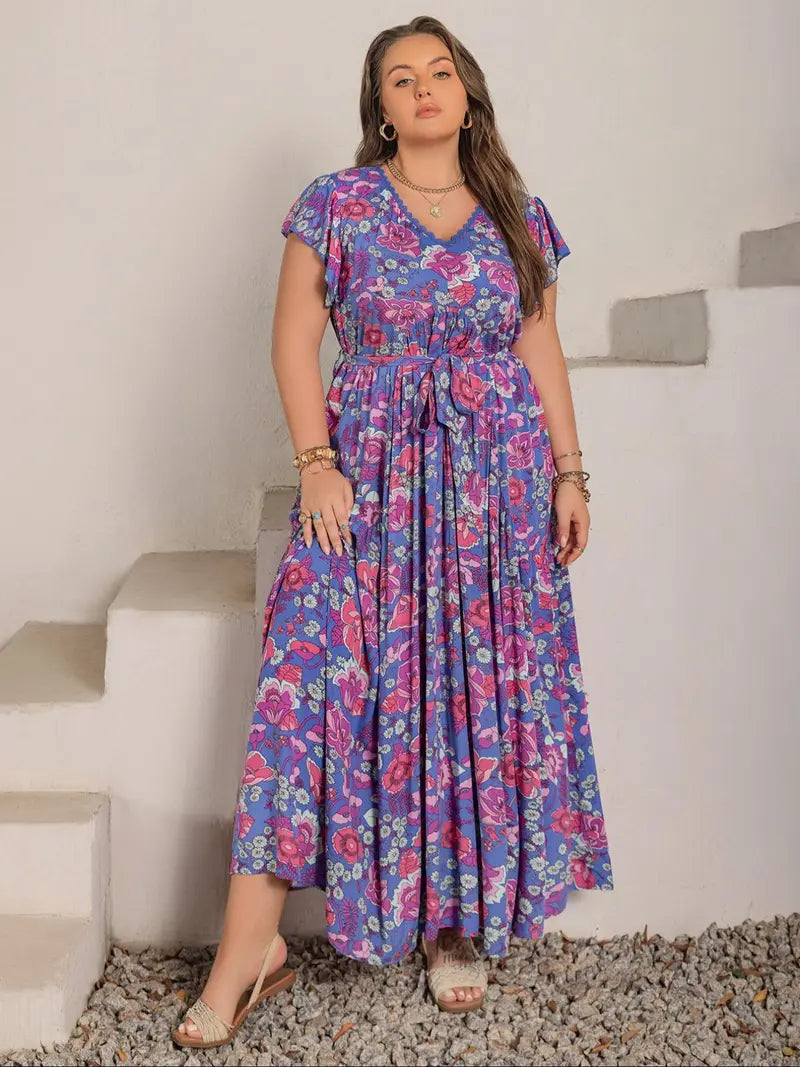 A-line dress with butterfly sleeves, belt, ruffled hem, and floral print