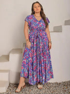 A-line dress with butterfly sleeves, belt, ruffled hem, and floral print