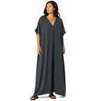 Women's long, flowy, oversized V-neck dress – chic and comfortable for summer.