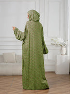 Plus-Size Fashion Floral Dress with Hood and Drawstring — featuring a loose fit, long lantern sleeves, and a modest yet casual style.
