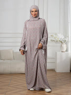 Plus-Size Fashion Floral Dress with Hood and Drawstring — featuring a loose fit, long lantern sleeves, and a modest yet casual style.