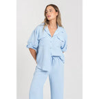Two-piece set: loose-fitting shirt-style top, loose-fitting trousers, elastic waistband.