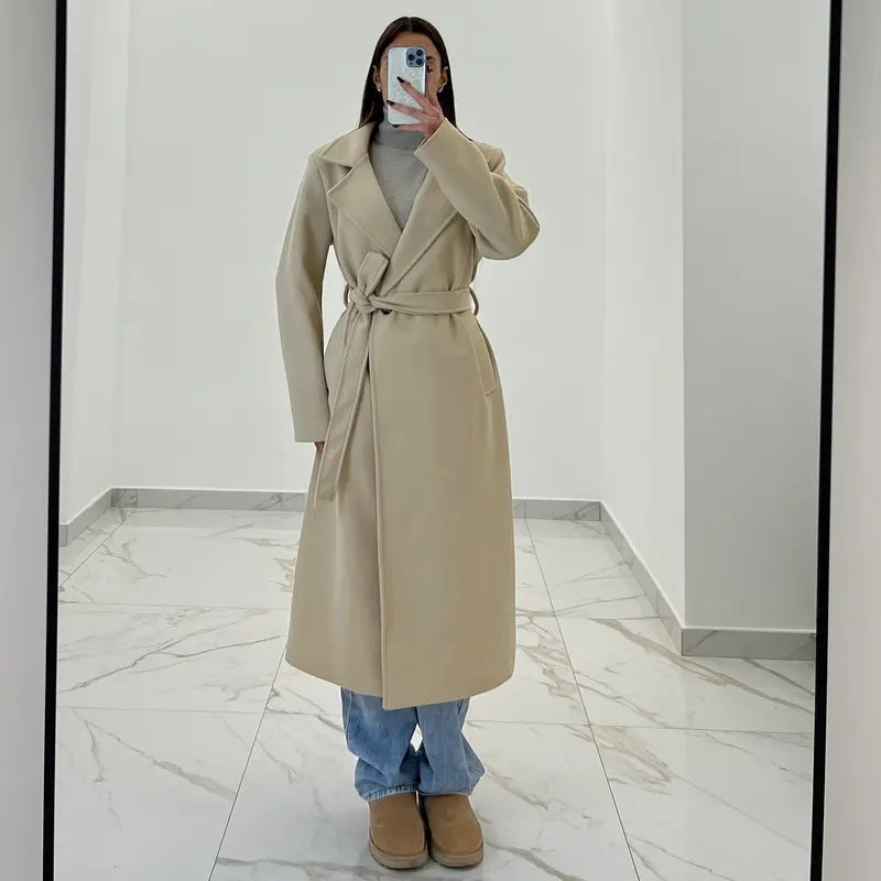 Coat with a belt at the waist