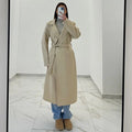 Coat with a belt at the waist