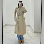 Coat with a belt at the waist