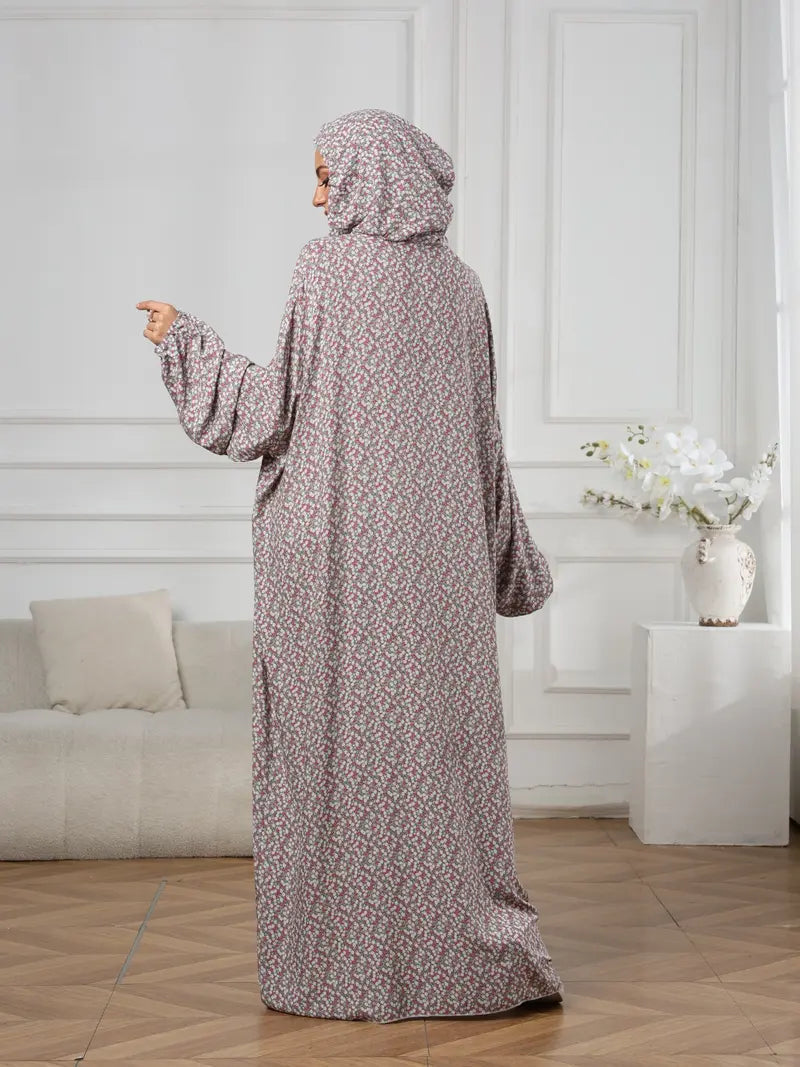 Plus-Size Fashion Floral Dress with Hood and Drawstring — featuring a loose fit, long lantern sleeves, and a modest yet casual style.