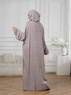 Plus-Size Fashion Floral Dress with Hood and Drawstring — featuring a loose fit, long lantern sleeves, and a modest yet casual style.