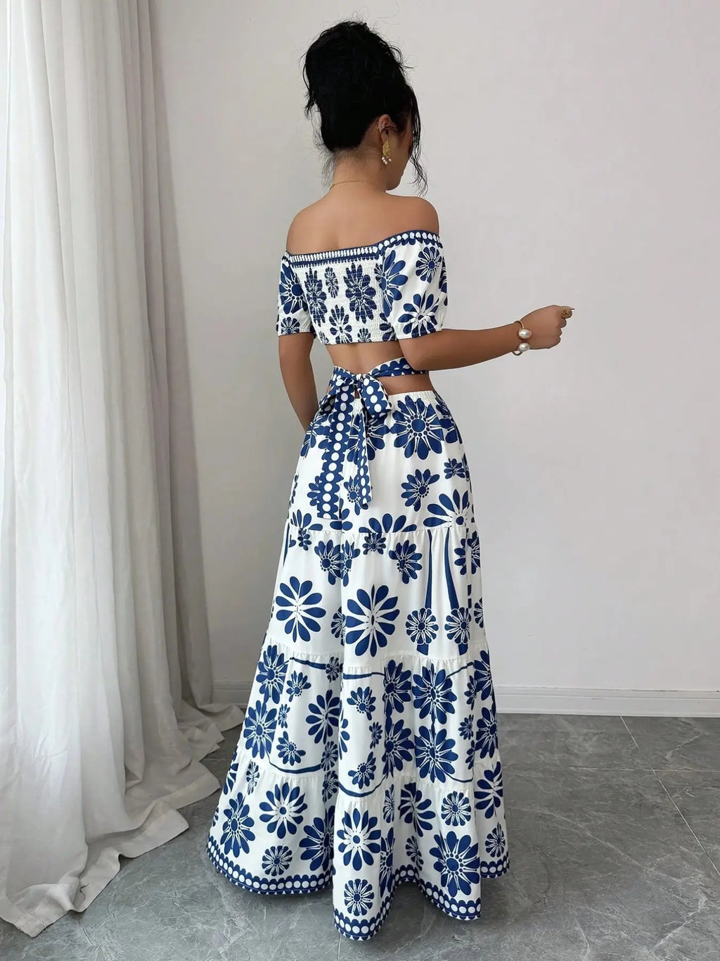 Women's off-the-shoulder short-sleeve floral dress with waist cutouts