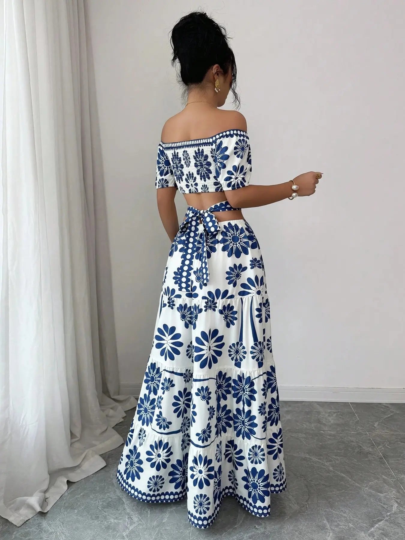 Women's off-the-shoulder short-sleeve floral dress with waist cutouts